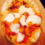 Homemade Pizza with Mozzarella, sautéed leeks, butternut squash, and pancetta
