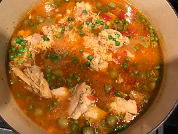 Asopao Puerto Rican style chicken stew coming together in pot 