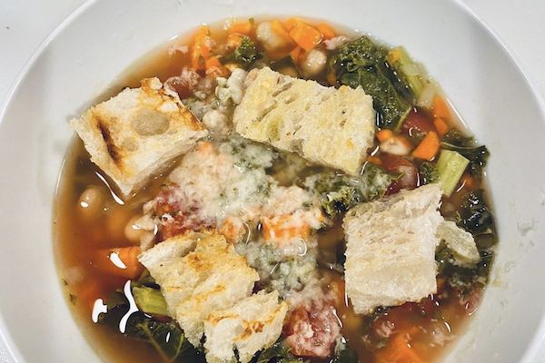 Italian Sausage and Kale Soup in the crockpot 9 hrs on low with homemade Garlic Croutons Yum